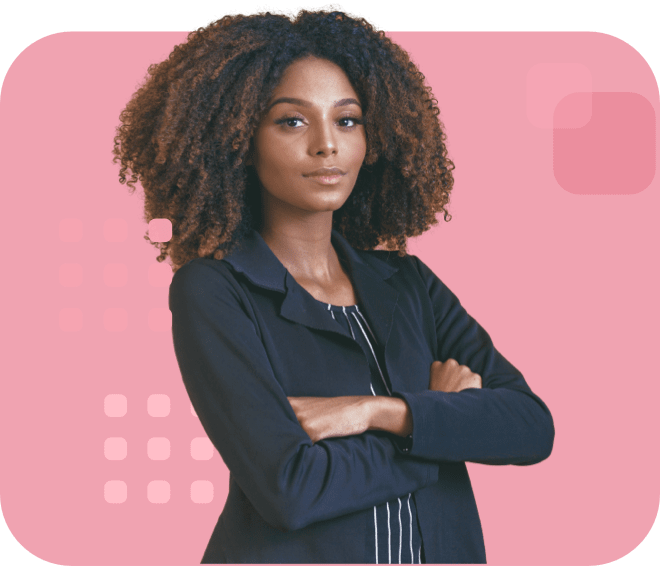 Confident individual with voluminous curly hair, wearing a dark blazer, and arms crossed.