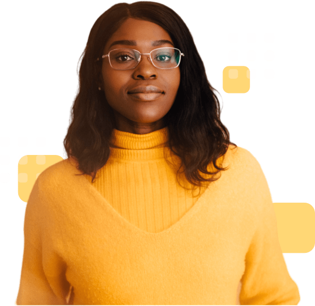Confident person with shoulder-length hair and glasses, wearing a yellow sweater.
