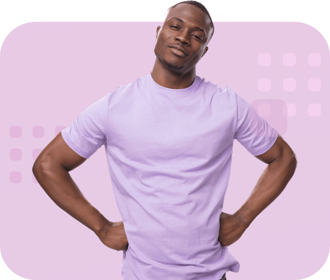 Individual standing with hands on hips, wearing a light-purple T-shirt, and smiling slightly.
